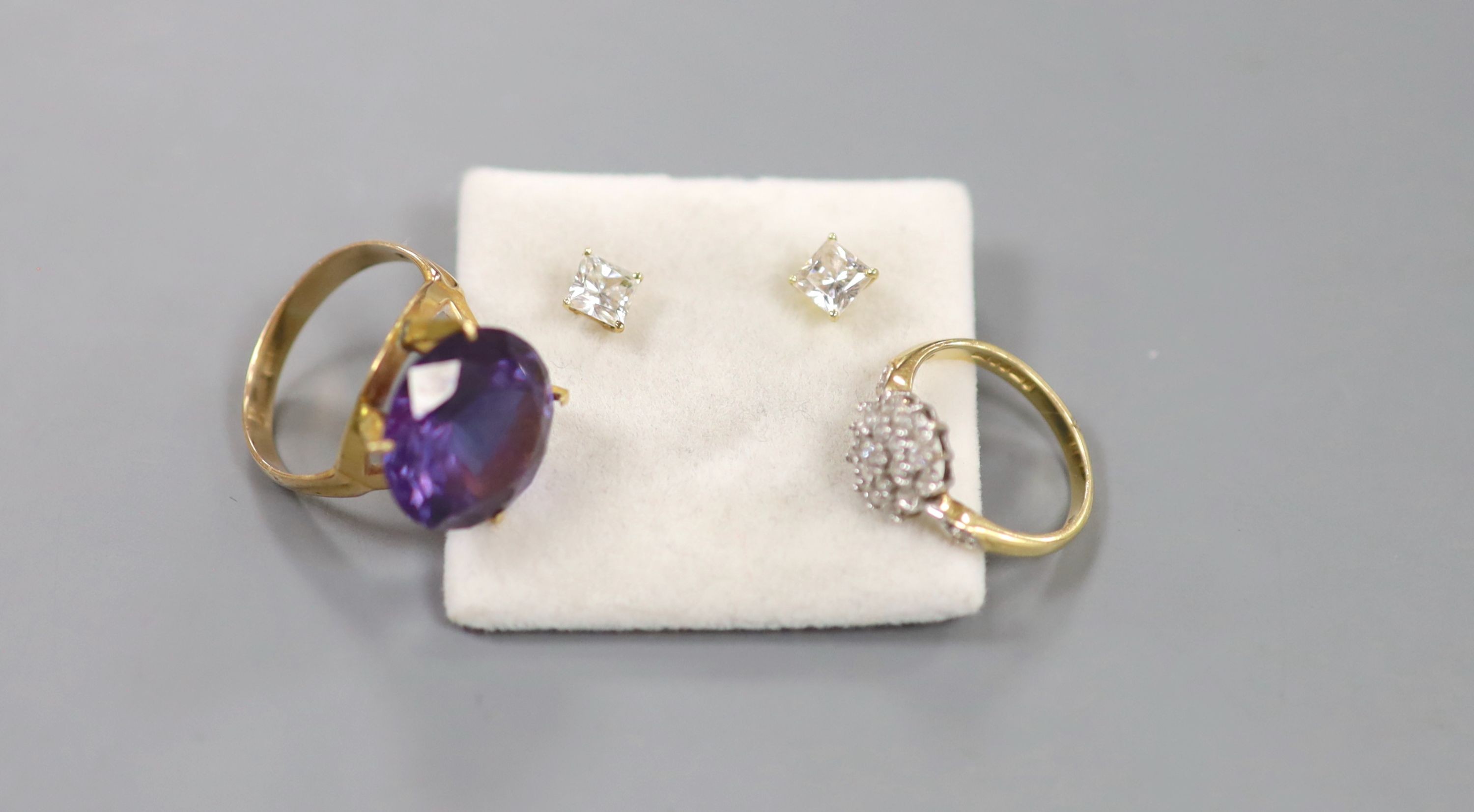 Two 14k and gem set rings and a pair of ear studs